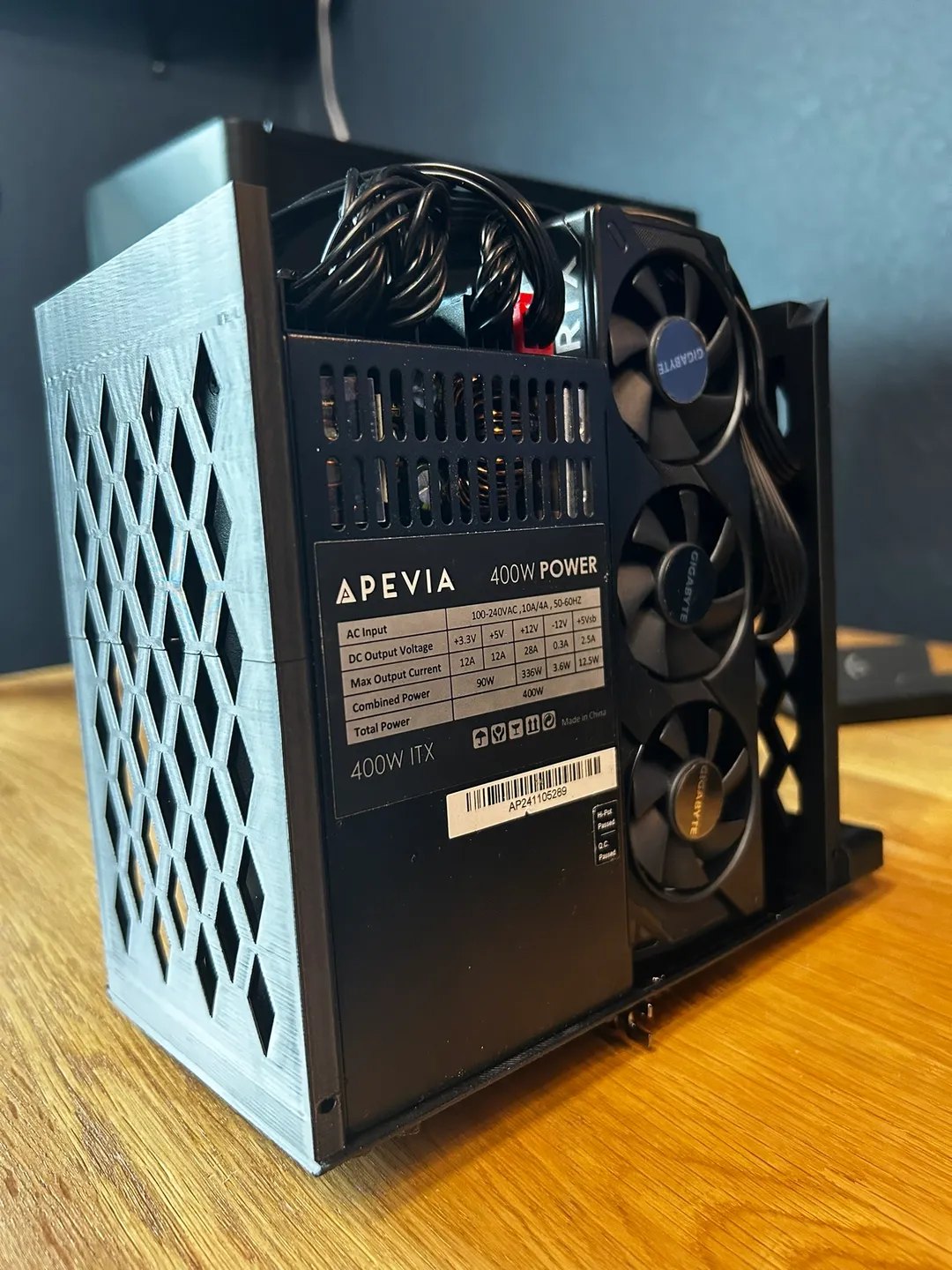 The printed skeleton with a Flex ATX power supply and a low profile graphics card stacked in the same column
