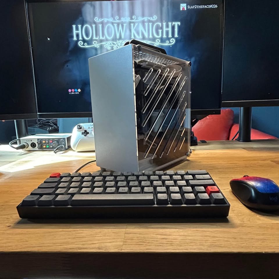 Mini-ITX backpack gaming rig on desk with mechanical keyboard